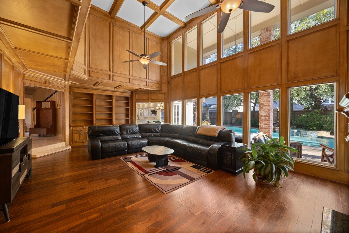 8807 Chelmsford Lane Spring, TX 77379 - Photo 11 of 50 a living room with furniture a fireplace and a floor to ceiling window