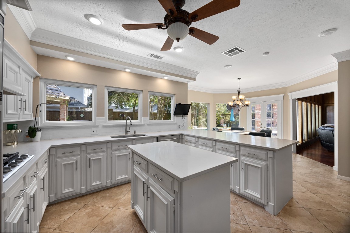 8807 Chelmsford Lane Spring, TX 77379 - Photo 15 of 50 a kitchen with a sink stove and cabinets
