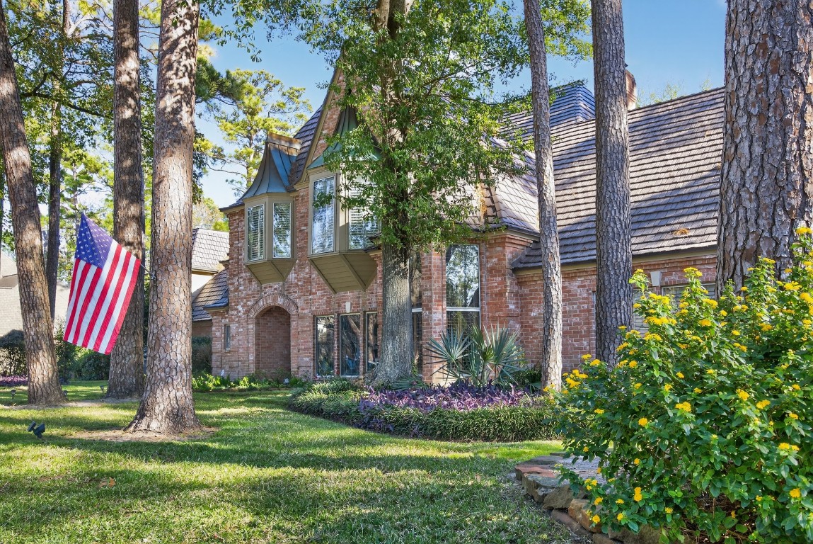 8807 Chelmsford Lane Spring, TX 77379 - Photo 2 of 50 a front view of a house with a yard and large tree