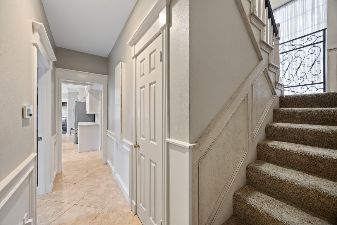 8807 Chelmsford Lane Spring, TX 77379 - Photo 21 of 50 a view of a hallway with wooden floor and staircase