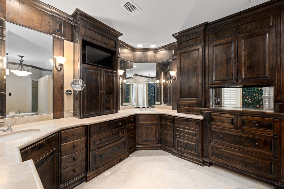 8807 Chelmsford Lane Spring, TX 77379 - Photo 29 of 50 a large kitchen with stainless steel appliances wooden cabinets and a sink