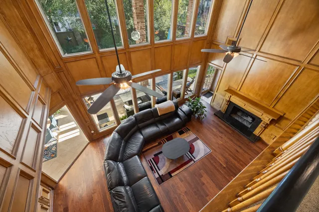 a view of a living room with furniture and entryway