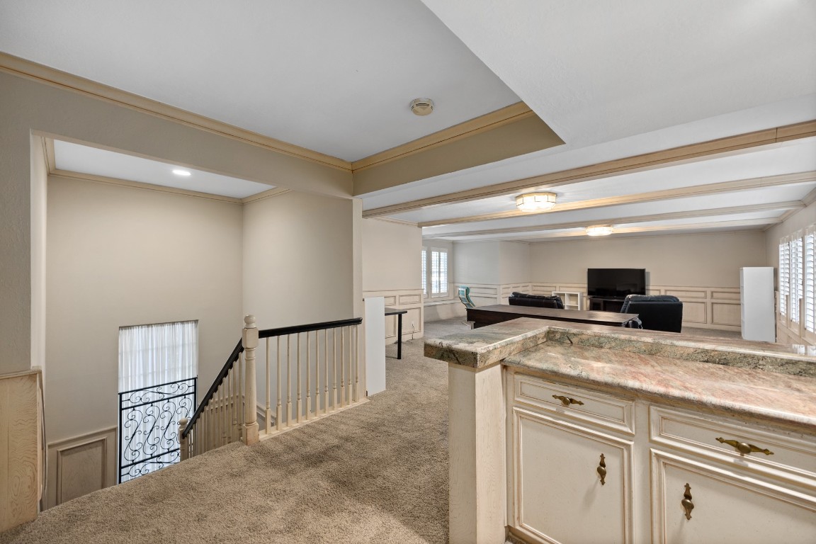 8807 Chelmsford Lane Spring, TX 77379 - Photo 40 of 50 a kitchen with a stove a microwave and a refrigerator