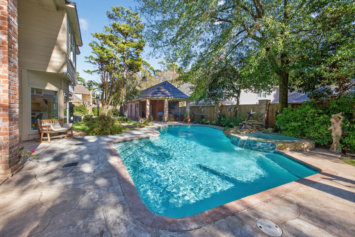 8807 Chelmsford Lane Spring, TX 77379 - Photo 43 of 50 a front view of a house with garden