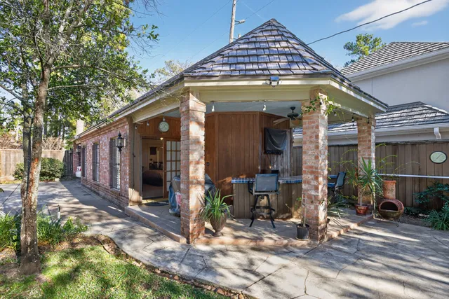 a view of a house with wooden fence