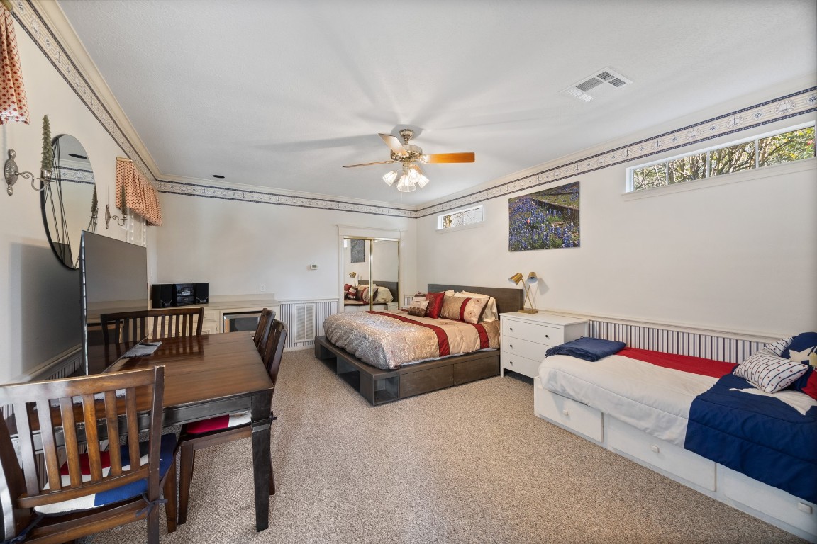 8807 Chelmsford Lane Spring, TX 77379 - Photo 46 of 50 a bedroom with furniture fireplace and a window