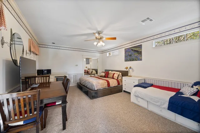 a bedroom with furniture fireplace and a window