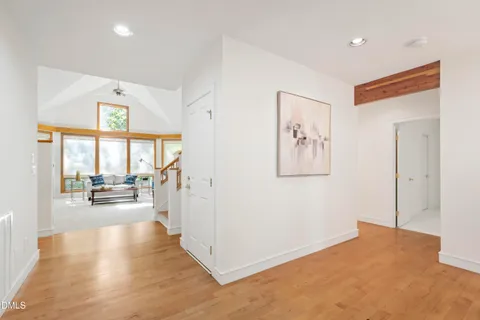 a kitchen with stainless steel appliances granite countertop a refrigerator a oven and a sink