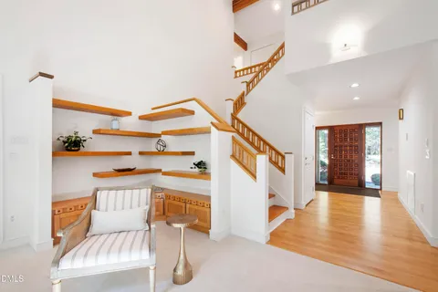 a kitchen with stainless steel appliances granite countertop a sink and a refrigerator