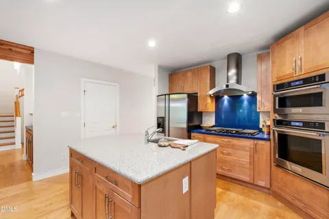 a view of a porch with wooden floor and outdoor space