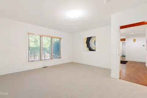a bathroom with a bath tub with a shower