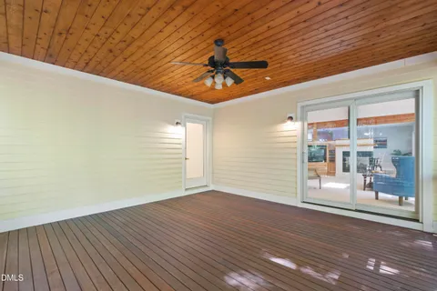 a bedroom with a bed and a white cabinet