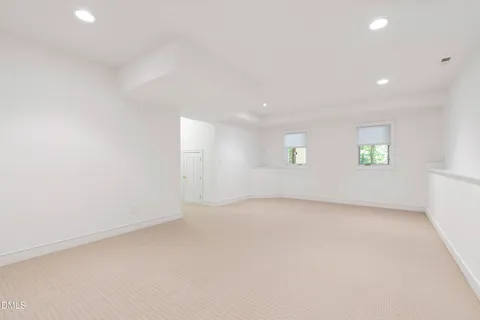 a view of a house with a tree in front