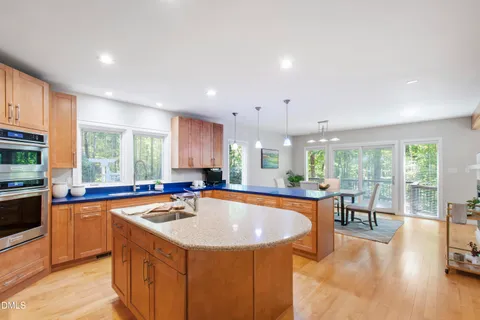 a spacious bedroom with a bed and a large window
