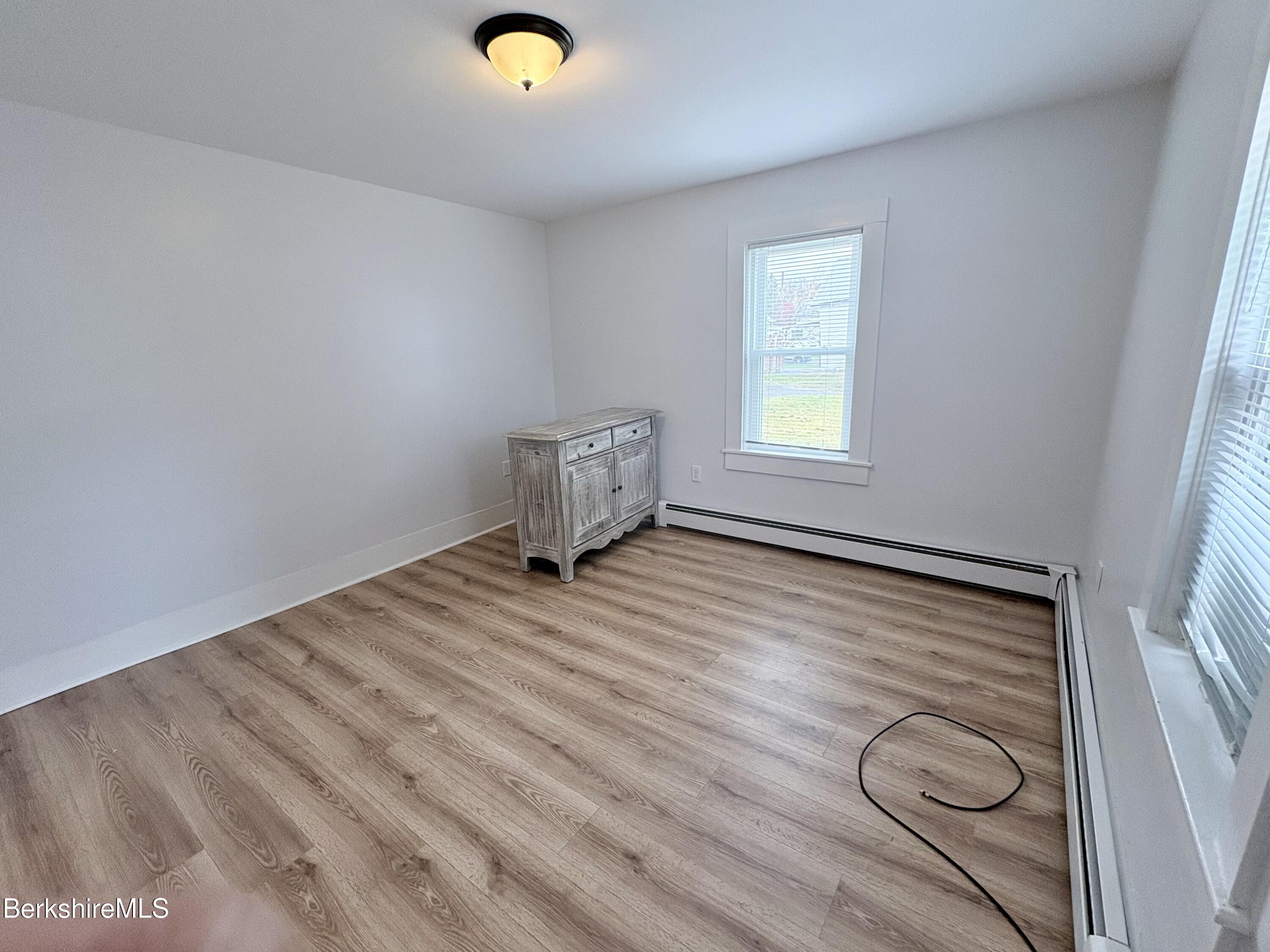 50 Temple Street Adams, MA 01220 - Photo 4 of 13 a view of empty room with wooden floor