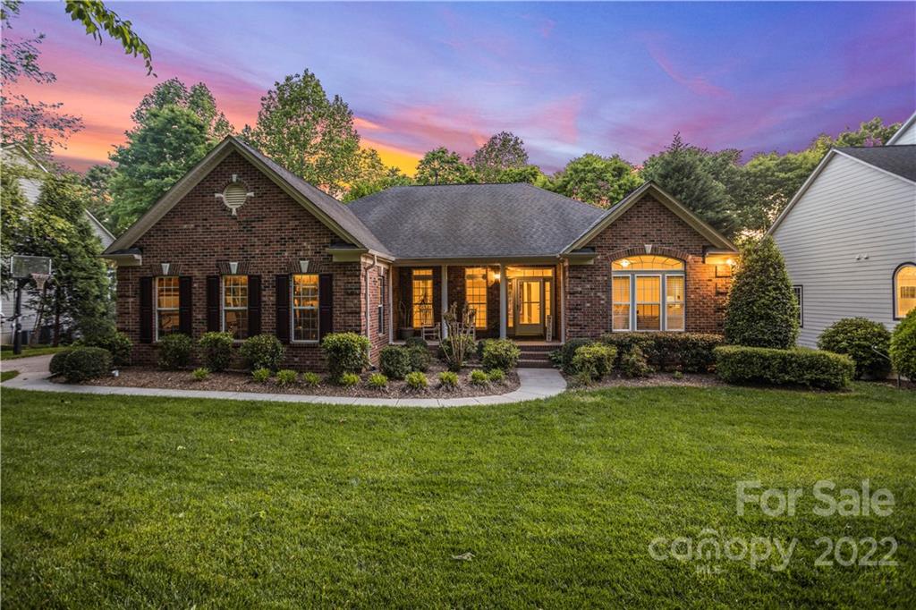 1292 Valhalla Drive Denver, NC 28037 - Photo 1 of 47 a front view of a house with swimming pool having outdoor seating