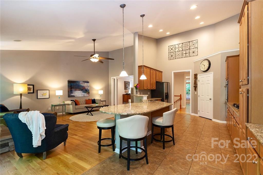 1292 Valhalla Drive Denver, NC 28037 - Photo 12 of 47 a living room with couches kitchen view and a chandelier