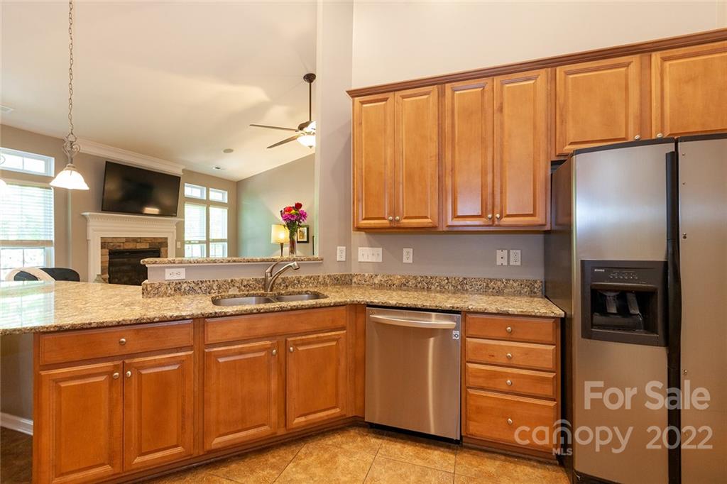 1292 Valhalla Drive Denver, NC 28037 - Photo 14 of 47 a kitchen with kitchen island granite countertop appliances cabinets and a sink