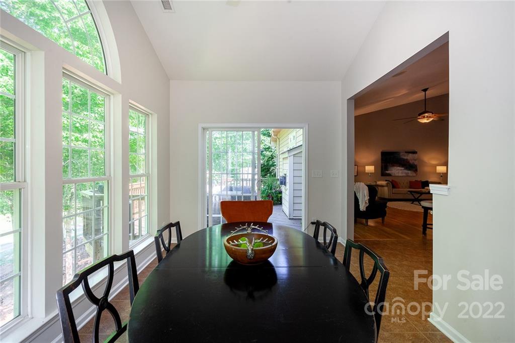 1292 Valhalla Drive Denver, NC 28037 - Photo 17 of 47 a dining room with furniture and floor to ceiling windows