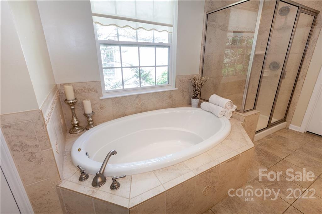 1292 Valhalla Drive Denver, NC 28037 - Photo 22 of 47 a bathroom with a tub and a window