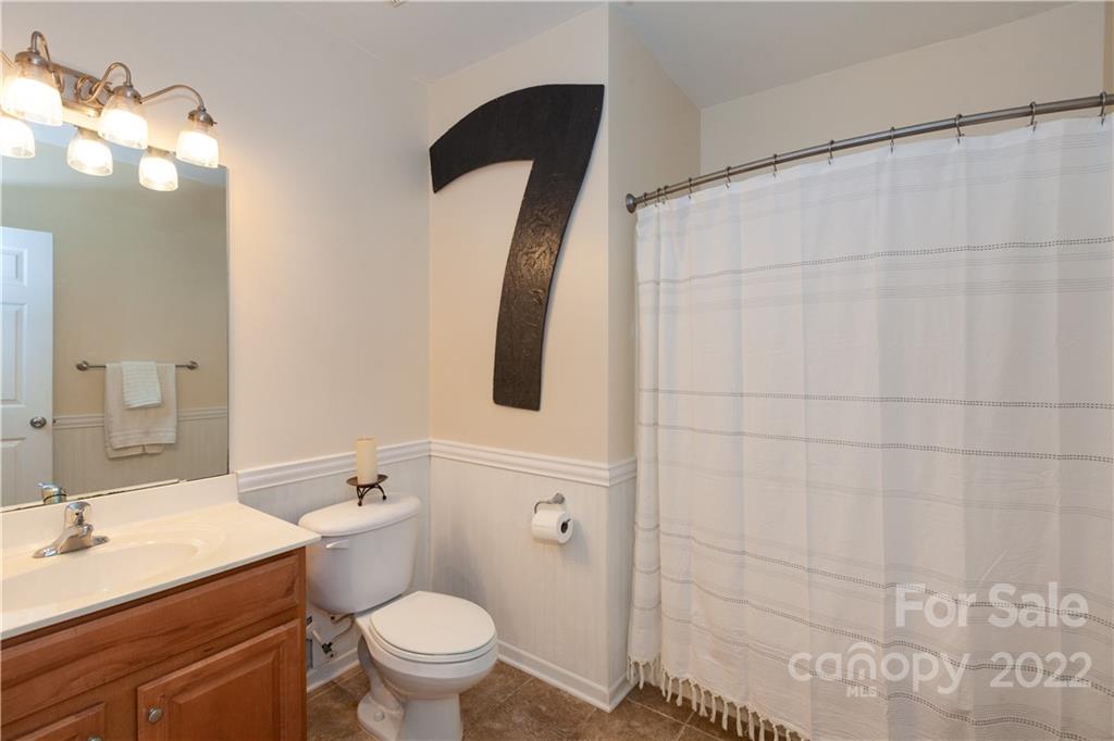1292 Valhalla Drive Denver, NC 28037 - Photo 36 of 47 a bathroom with a sink a toilet and shower