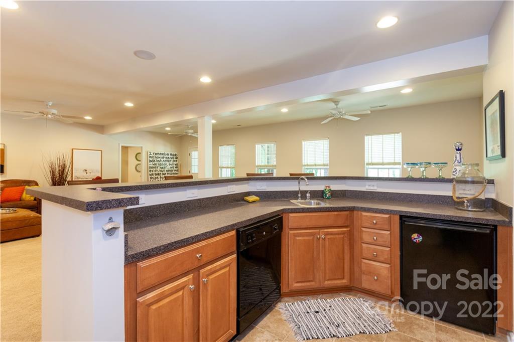 1292 Valhalla Drive Denver, NC 28037 - Photo 38 of 47 a kitchen with stainless steel appliances granite countertop a sink and stove top oven