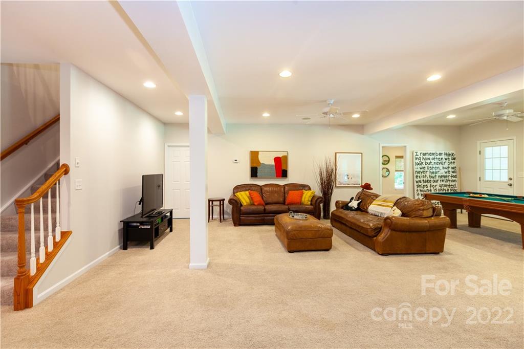 1292 Valhalla Drive Denver, NC 28037 - Photo 39 of 47 a living room with furniture and a large window