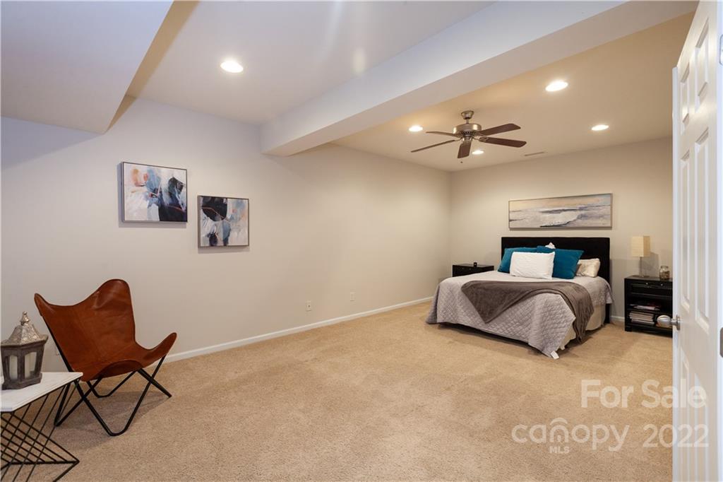 1292 Valhalla Drive Denver, NC 28037 - Photo 45 of 47 a bedroom with a bed and chair