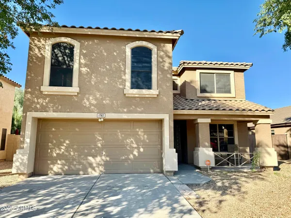 a front view of a house with yard