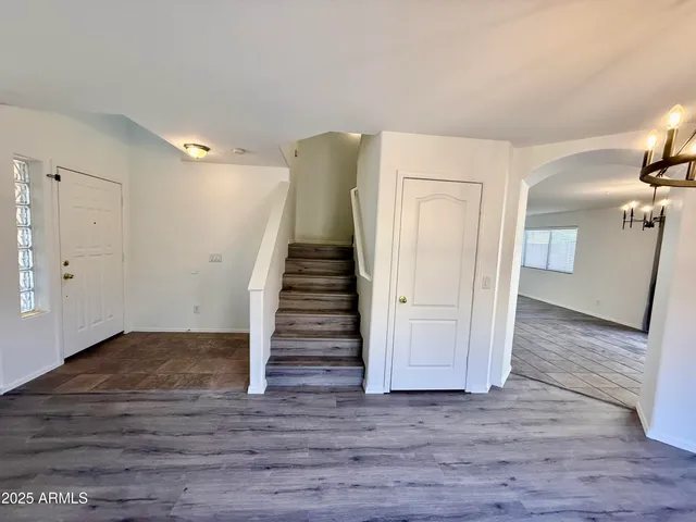 a view of entryway with wooden floor