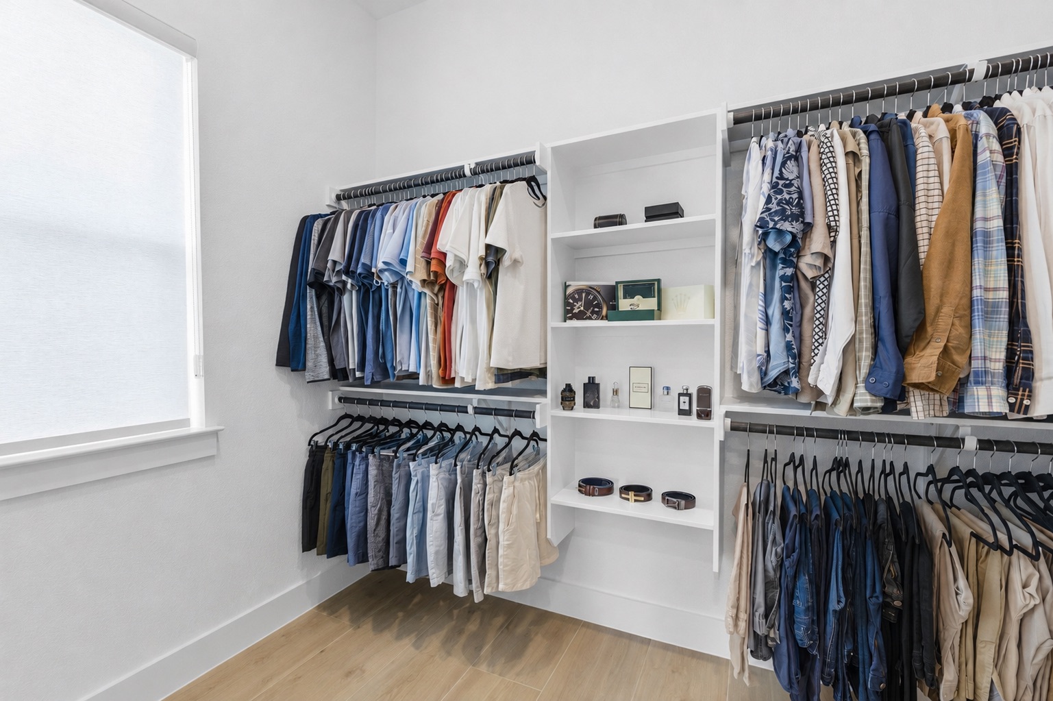 836 Villa Rialto View Leander, TX 78641 - Photo 18 of 33 Custom-designed closet offers plentiful storage with integrated shelving and hanging rails for seamless organization.