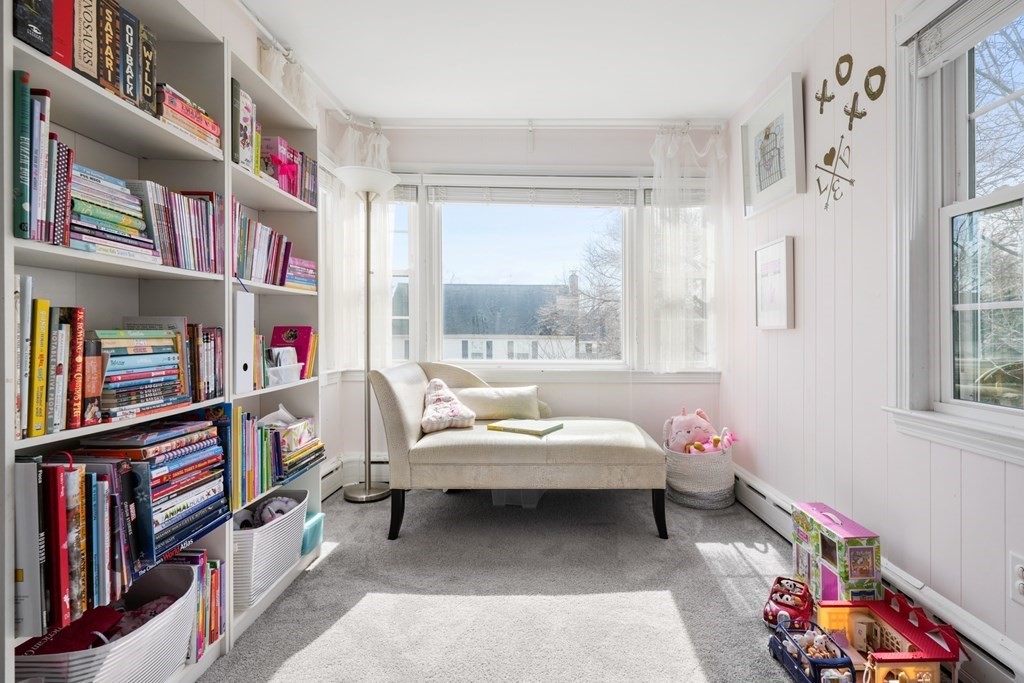 63 Standish Road Milton, MA 02186 - Photo 12 of 38 a bedroom with furniture and a book shelf