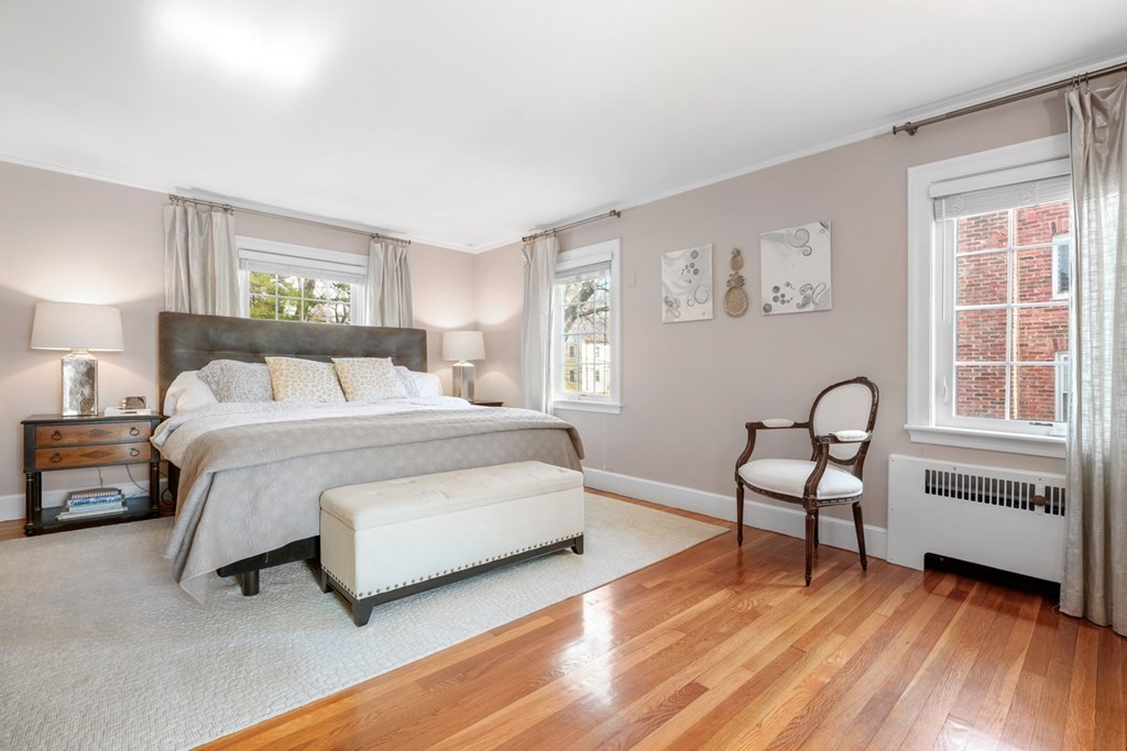 63 Standish Road Milton, MA 02186 - Photo 15 of 38 a bedroom with a bed and a window with chair