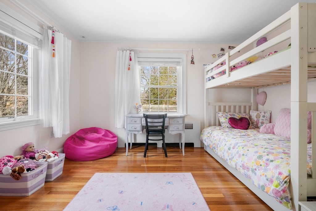 63 Standish Road Milton, MA 02186 - Photo 20 of 38 a bedroom with a bed and large windows