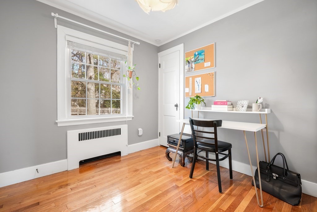 63 Standish Road Milton, MA 02186 - Photo 22 of 38 a view of a workspace with furniture and a window