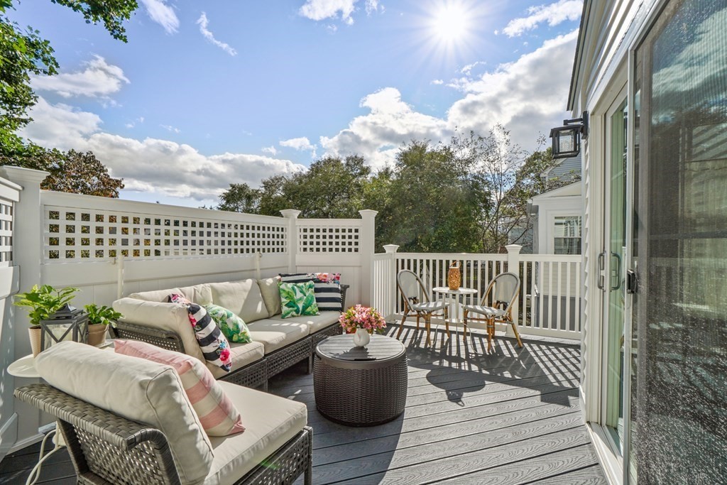 63 Standish Road Milton, MA 02186 - Photo 27 of 38 a view of a chair and tables back yard of the house