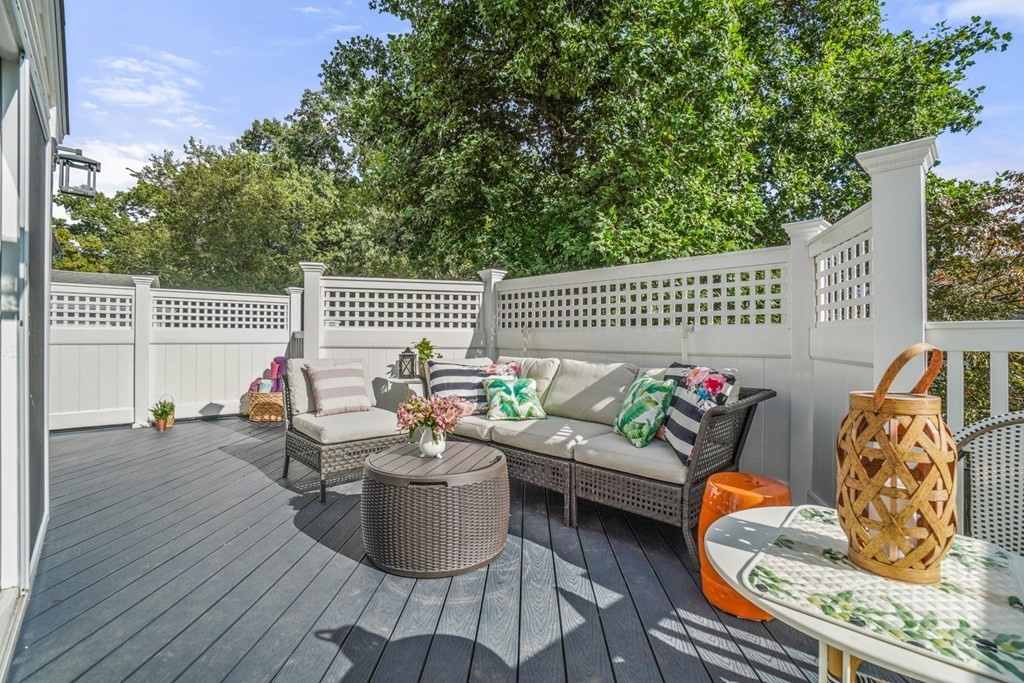 63 Standish Road Milton, MA 02186 - Photo 28 of 38 a balcony with wooden floor and furniture