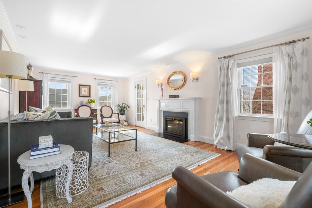 63 Standish Road Milton, MA 02186 - Photo 3 of 38 a living room with furniture a fireplace and a large window