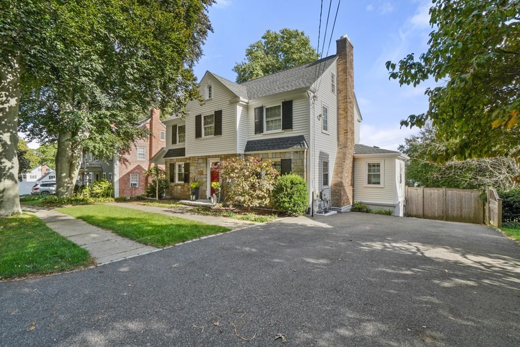 63 Standish Road Milton, MA 02186 - Photo 34 of 38 a front view of a house with a yard and a tree