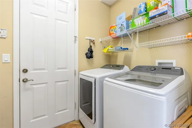 a utility room with dryer and washer