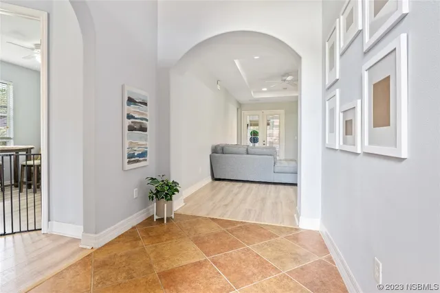 a view of an entryway with wooden floor