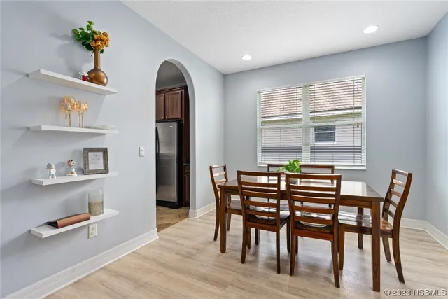 a dining room with furniture and window