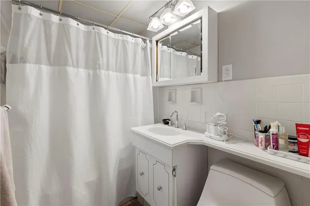 a utility room with a sink dryer and washer