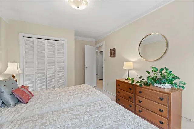 a bedroom with a bed and a dresser