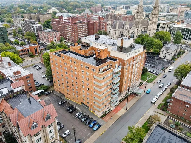 an aerial view of a city with parking space