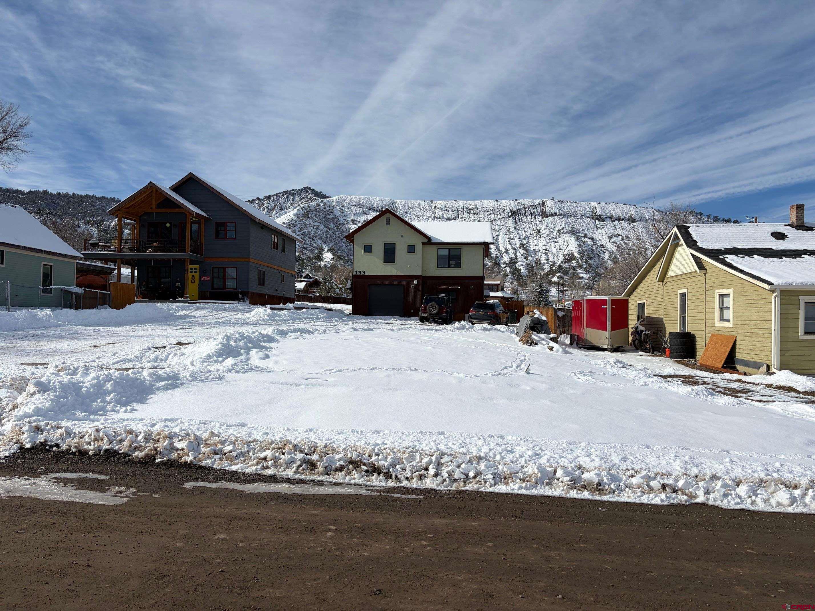 139 South Charlotte Street Ridgway, CO 81432 - Photo 2 of 26 a front view of a house with a yard