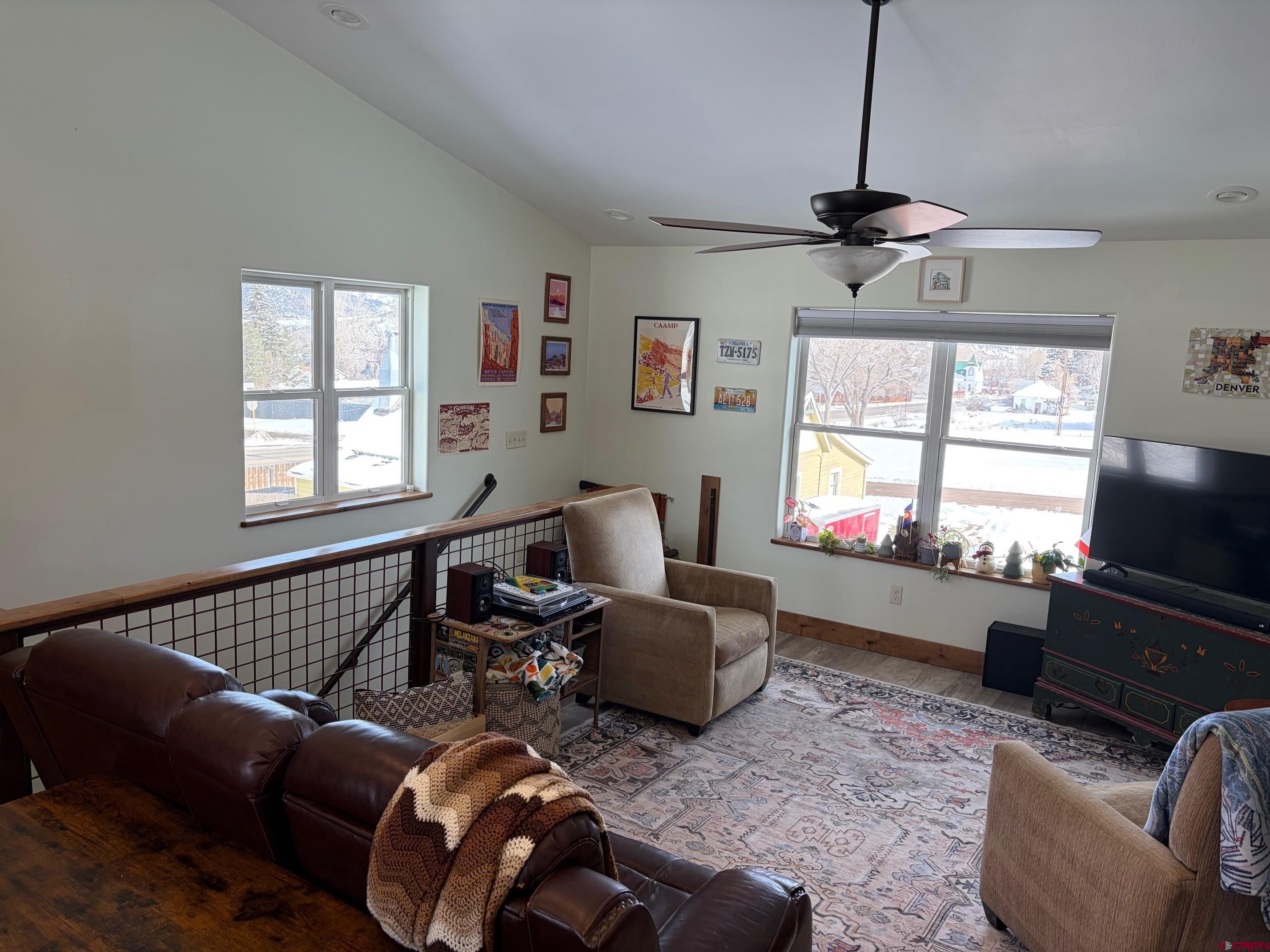 139 South Charlotte Street Ridgway, CO 81432 - Photo 8 of 26 a living room with furniture a window and a flat screen tv