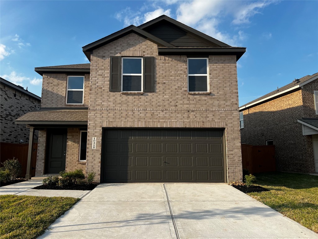 a front view of a house with yard