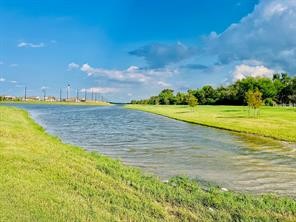 10418 Rocky Trail Beasley, TX 77417 - Photo 10 of 19 a view of a lake with a beach