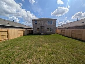 10418 Rocky Trail Beasley, TX 77417 - Photo 2 of 19 a view of a house with a back yard